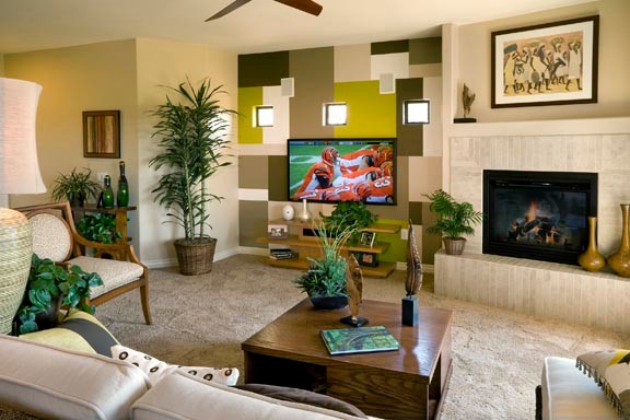 フェニックスにある中くらいなコンテンポラリースタイルのおしゃれなLDK (マルチカラーの壁、カーペット敷き、コーナー設置型暖炉、タイルの暖炉まわり、壁掛け型テレビ) の写真