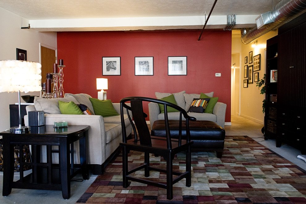 Immagine di un soggiorno minimal con pareti rosse