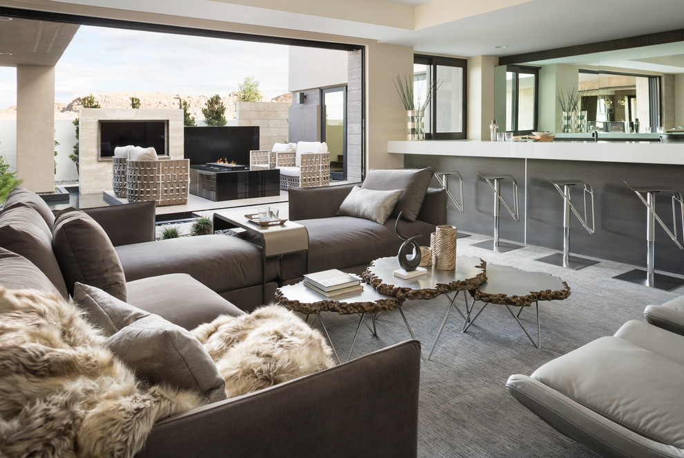 Inspiration for an expansive contemporary open plan living room in Las Vegas with white walls, carpet and grey floors.