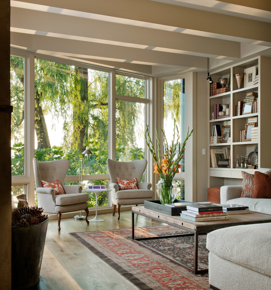 Elegant medium tone wood floor living room photo in Seattle