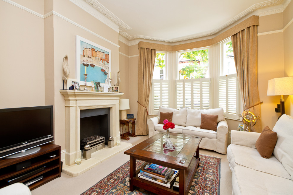 Living room - contemporary enclosed living room idea in Other with beige walls, a standard fireplace and a tv stand