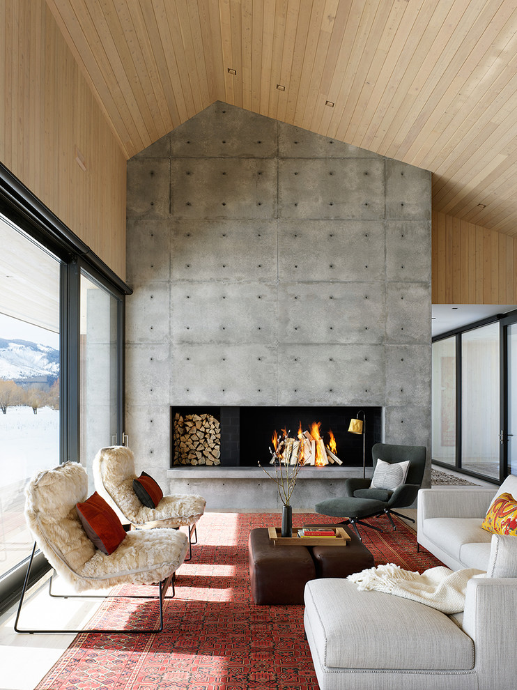 Contemporary open plan living room in Other with a ribbon fireplace and a concrete fireplace surround.