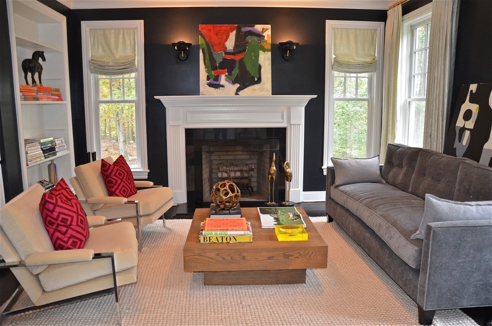 Trendy living room photo in New York with black walls, a standard fireplace and no tv