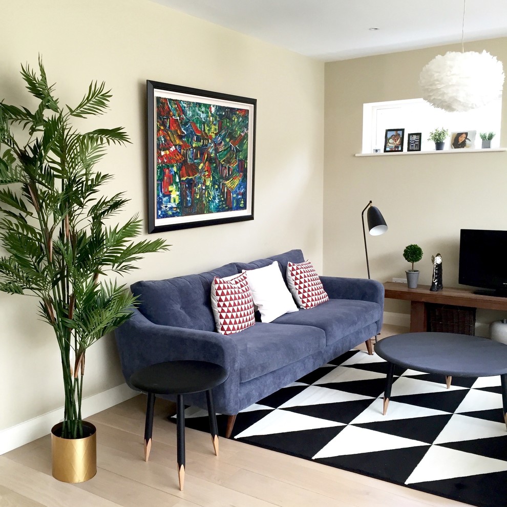 Photo of a medium sized contemporary formal enclosed living room in Dublin with white walls, carpet and a freestanding tv.