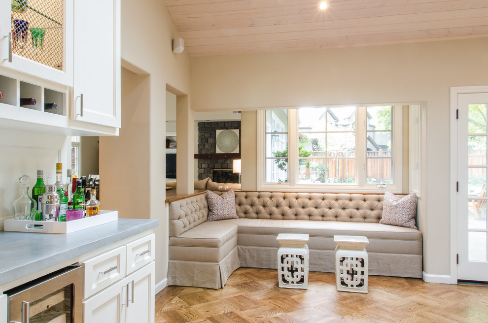 This is an example of a contemporary living room in San Francisco with beige walls and medium hardwood flooring.