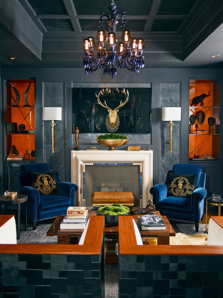 Example of a mid-sized trendy enclosed medium tone wood floor living room library design in Atlanta with gray walls, a standard fireplace, a stone fireplace and no tv