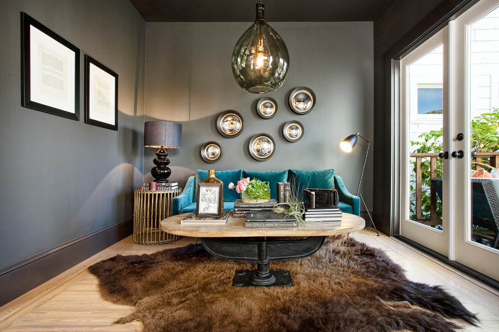 Photo of a contemporary grey and teal living room in San Francisco with grey walls.