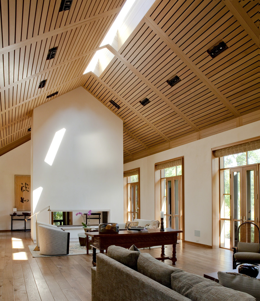 Exempel på ett modernt vardagsrum, med mellanmörkt trägolv