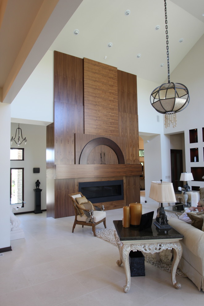 Imagen de salón clásico renovado con marco de chimenea de madera
