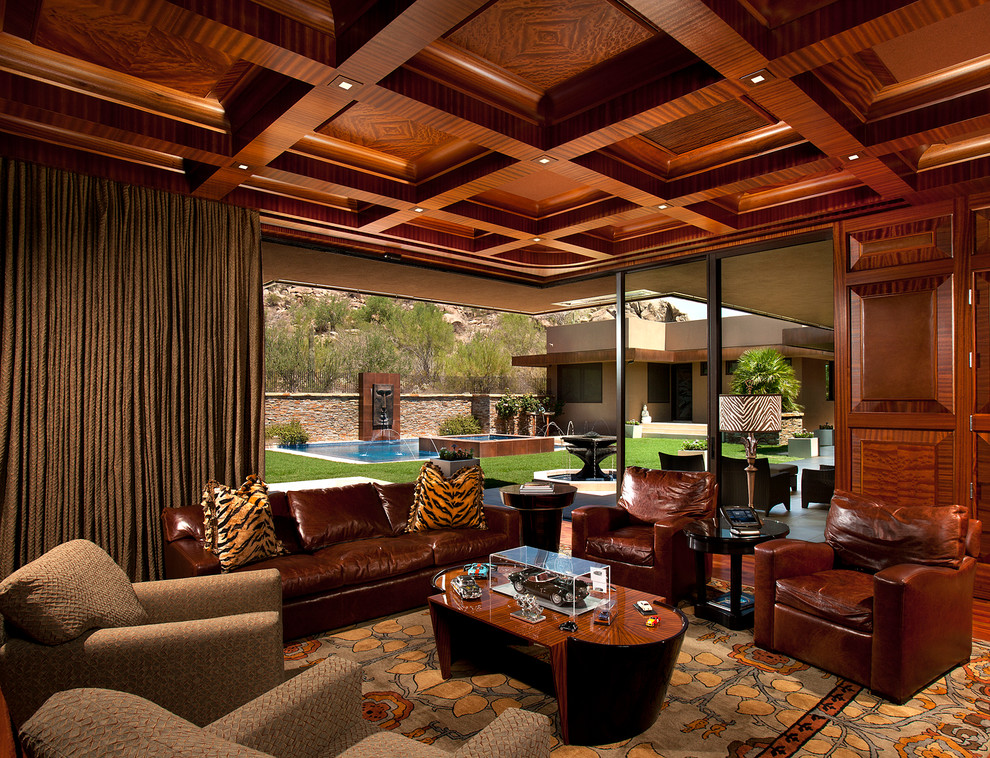 Medium sized contemporary formal enclosed living room in Phoenix with no fireplace, brown walls and dark hardwood flooring.