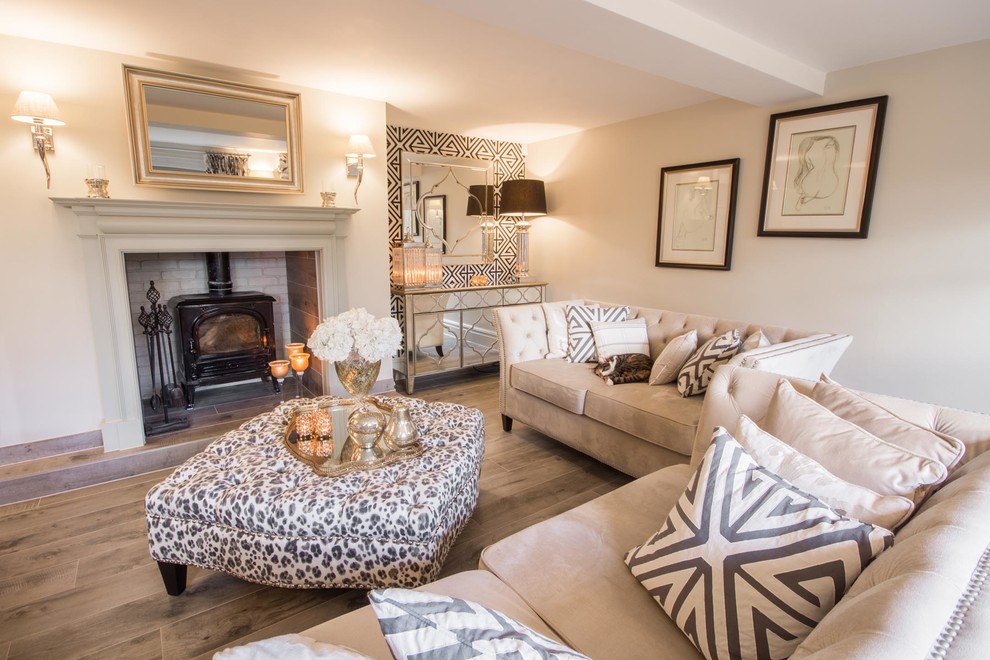 Living room - mid-sized transitional light wood floor and brown floor living room idea in Cheshire with white walls, a wood stove and a metal fireplace