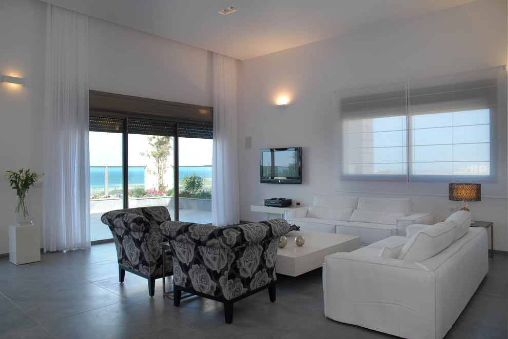 Photo of a contemporary living room curtain in Tel Aviv with concrete flooring.