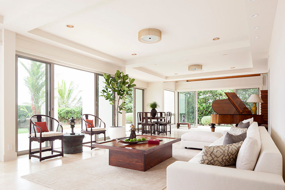 Example of a trendy travertine floor living room design in Hawaii