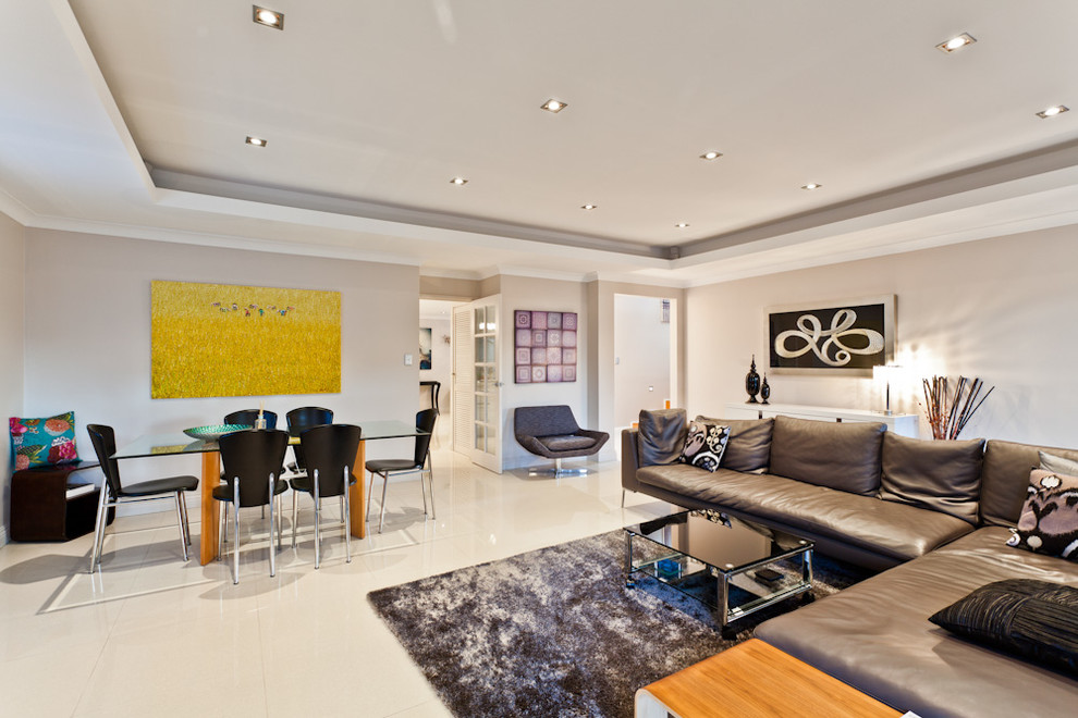 Contemporary open plan living room in Perth with white floors.