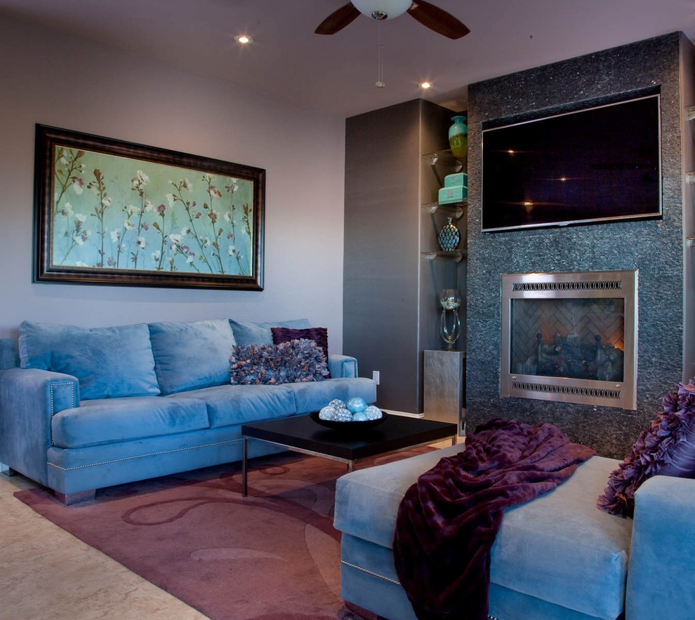 Idee per un soggiorno contemporaneo con pavimento in cemento e TV a parete