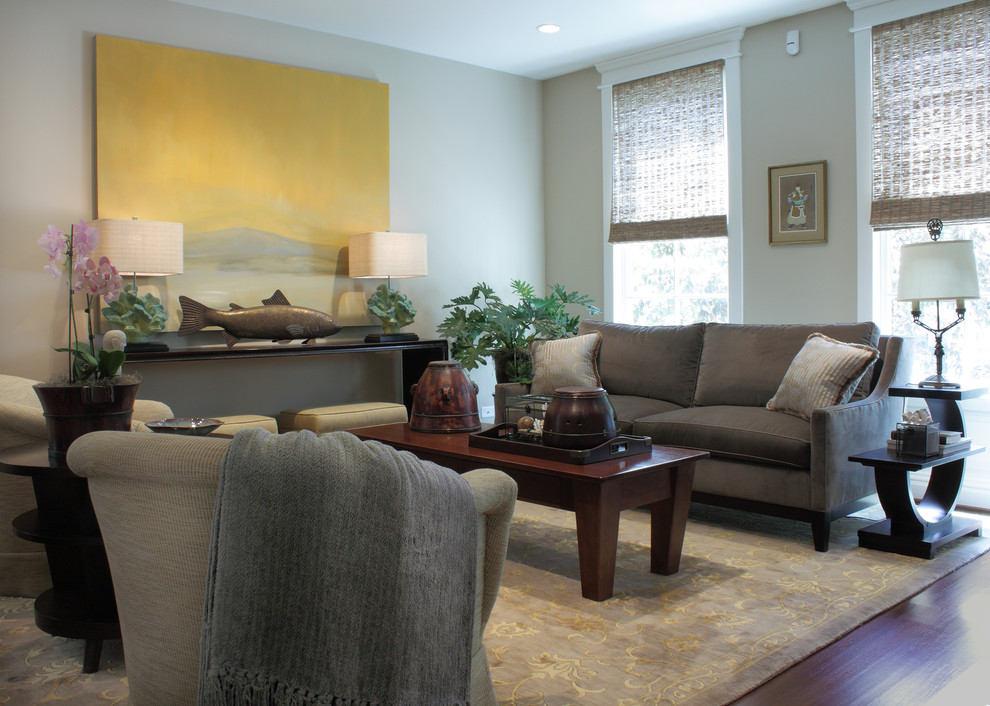 Cette image montre un salon gris et jaune design avec un mur beige.