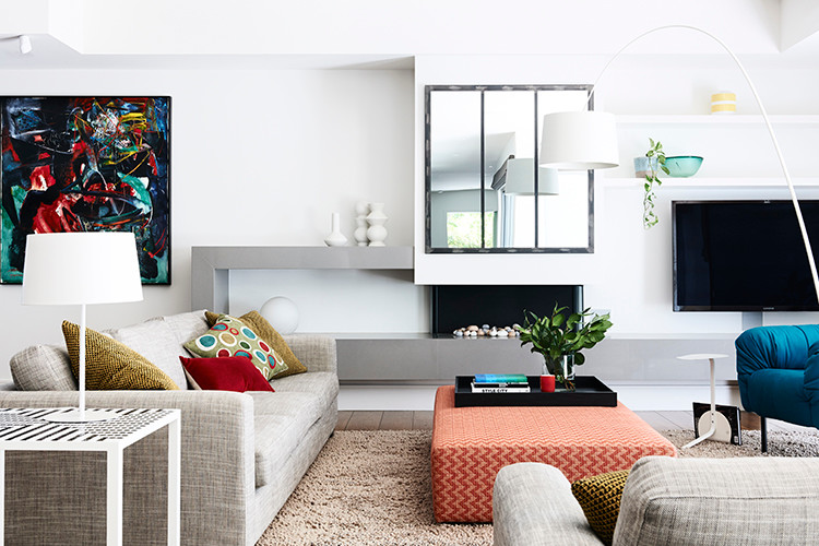 Living room - contemporary open concept living room idea in Melbourne with white walls, a standard fireplace, a plaster fireplace and a wall-mounted tv