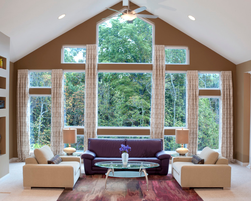 Example of a trendy beige floor living room design in San Diego with brown walls