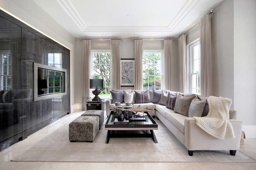 Mid-sized trendy formal living room photo in Surrey with gray walls and a wall-mounted tv