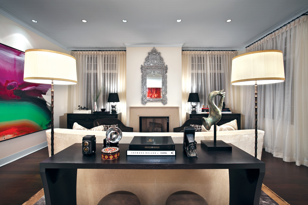 На фото: гостиная комната в современном стиле с бежевыми стенами, стандартным камином и красивыми шторами