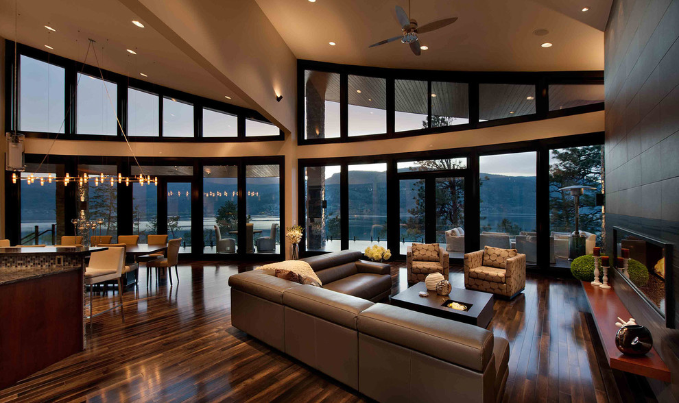 This is an example of a contemporary open plan living room in Vancouver with beige walls and a ribbon fireplace.