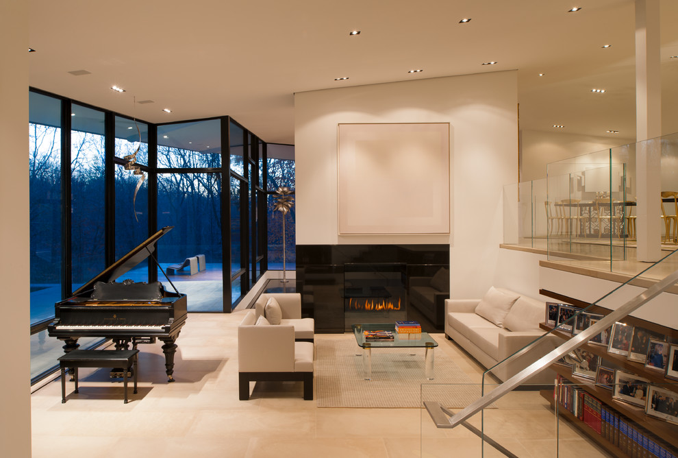 Свежая идея для дизайна: парадная, открытая гостиная комната в современном стиле с белыми стенами и стандартным камином без телевизора - отличное фото интерьера