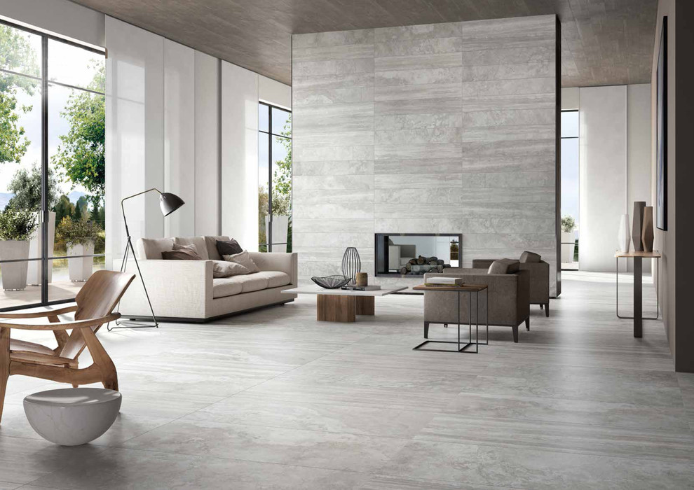 Ispirazione per un grande soggiorno minimal con pareti grigie, pavimento in gres porcellanato e pavimento grigio