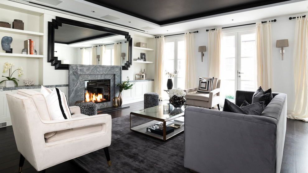 Inspiration for an expansive contemporary cream and black living room in London with a standard fireplace, a stone fireplace surround, brown floors, white walls and dark hardwood flooring.