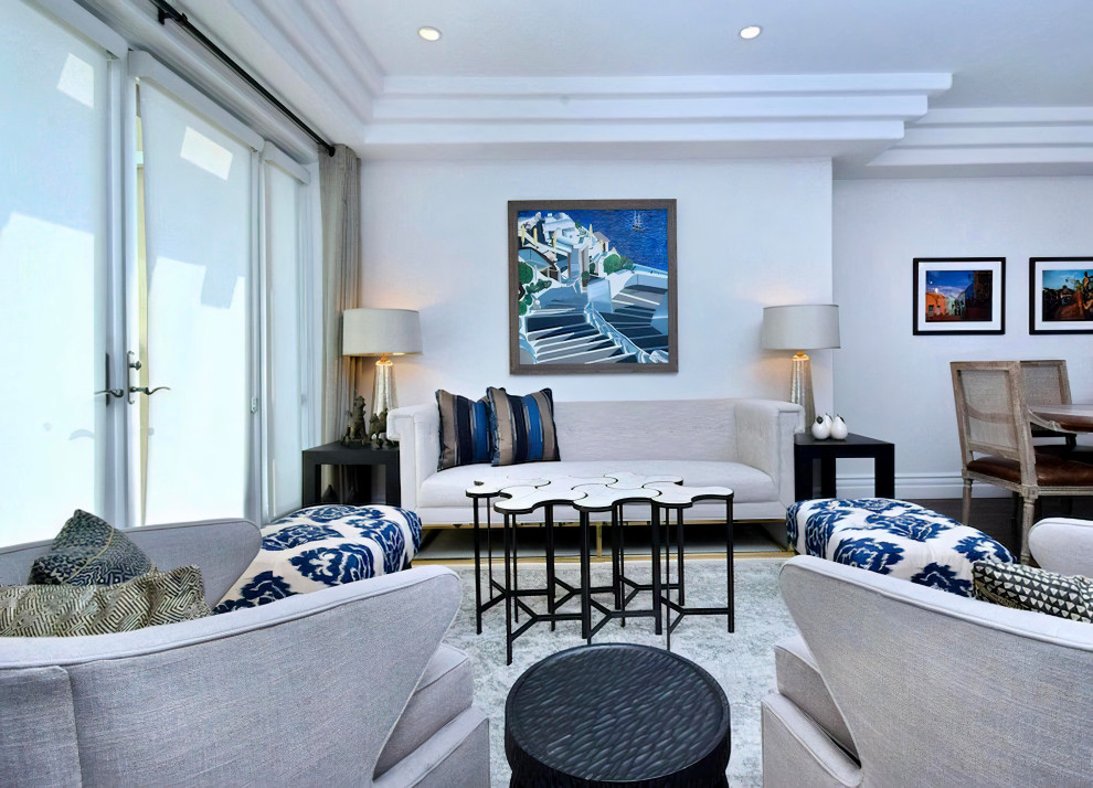 Идея дизайна: парадная, открытая гостиная комната среднего размера в средиземноморском стиле с белыми стенами, паркетным полом среднего тона, стандартным камином, фасадом камина из плитки, коричневым полом и многоуровневым потолком без телевизора