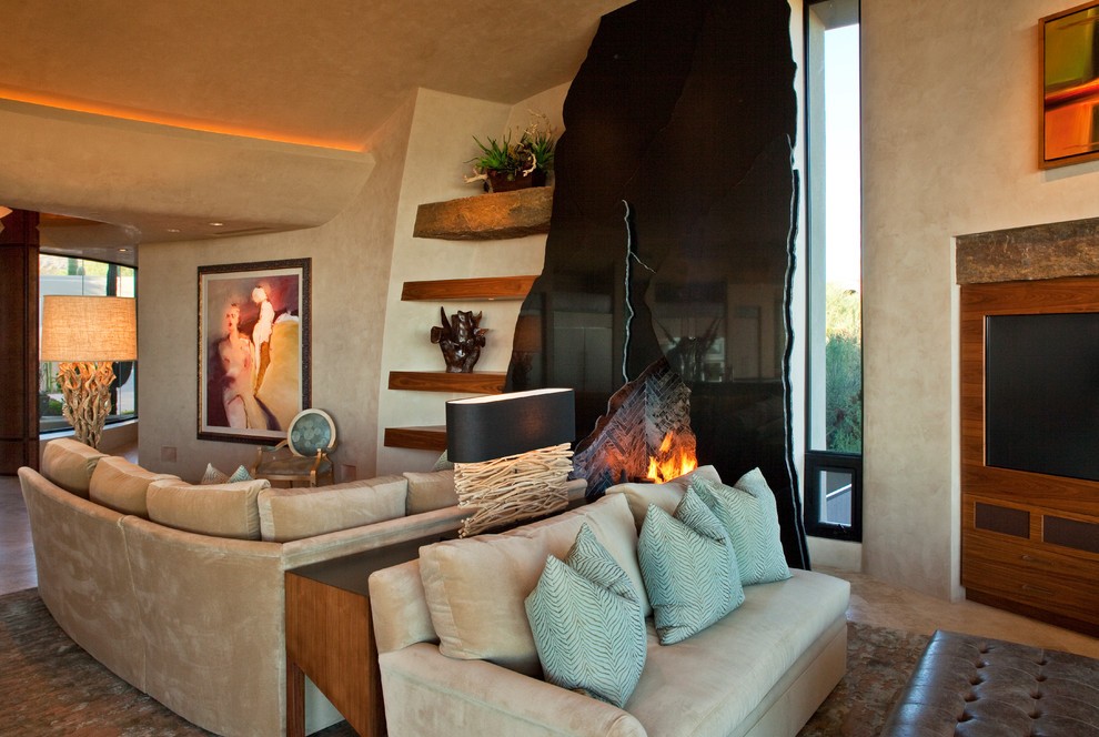 Inspiration pour un salon design avec une cheminée standard et un manteau de cheminée en pierre.