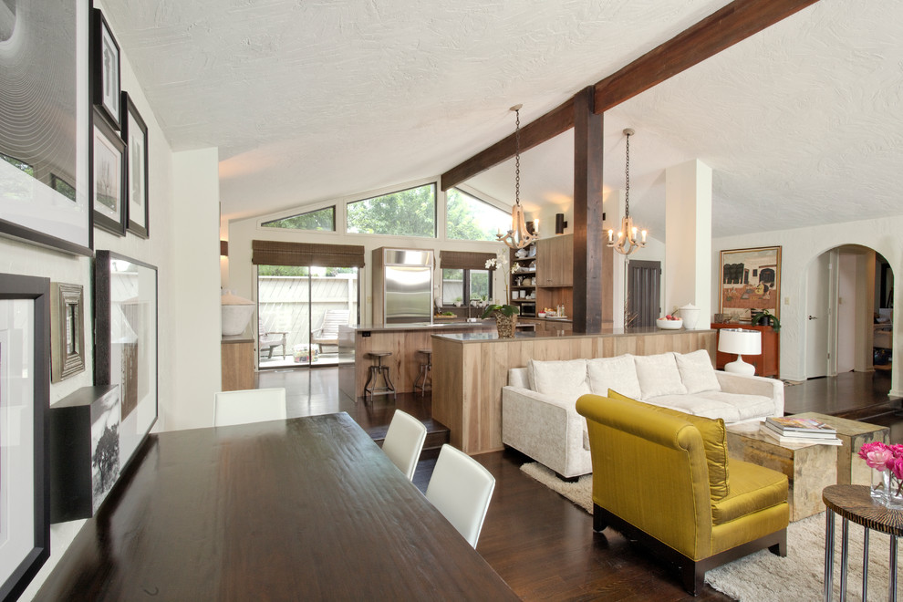 Example of a mid-sized transitional open concept dark wood floor living room design in Indianapolis with white walls, no fireplace and a wall-mounted tv