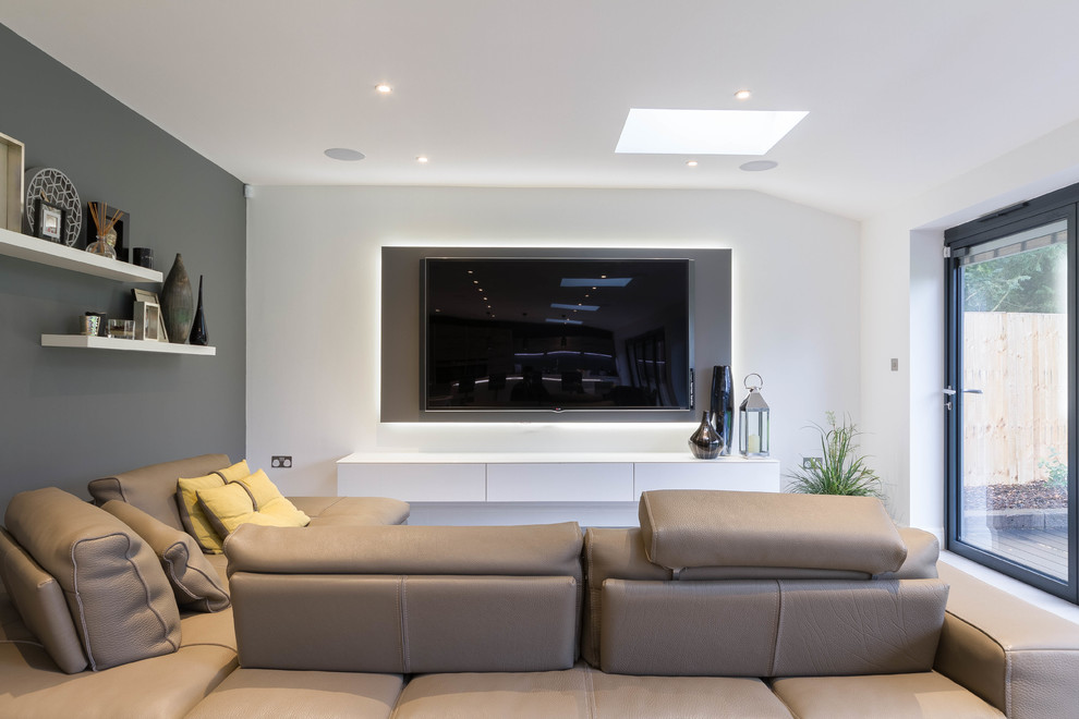 Design ideas for a medium sized contemporary enclosed living room in London with a wall mounted tv.