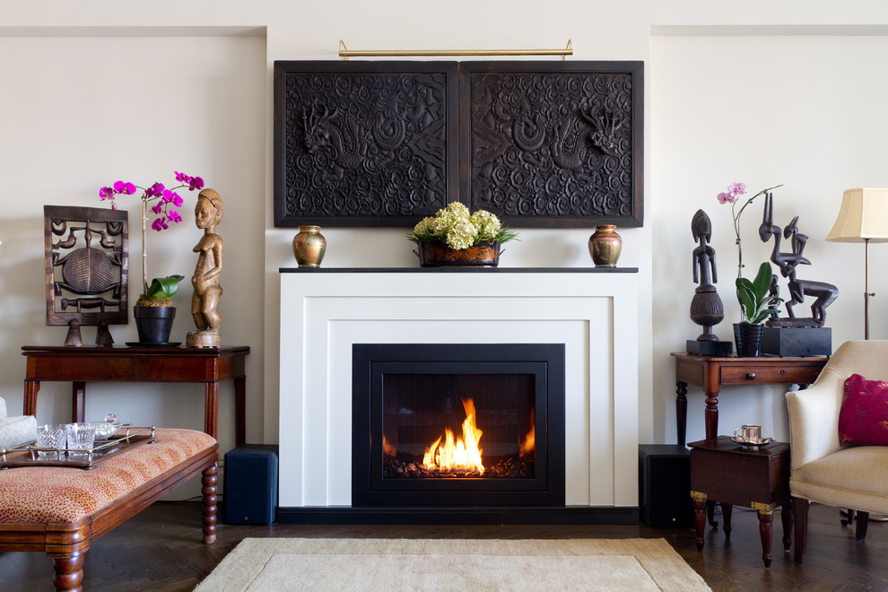 Mid-sized trendy dark wood floor living room photo in New York with a standard fireplace, a stone fireplace and white walls