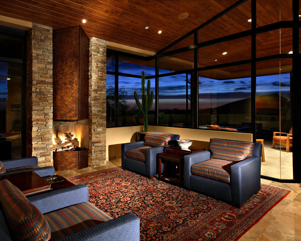 This is an example of a contemporary living room in Los Angeles with a stone fireplace surround.