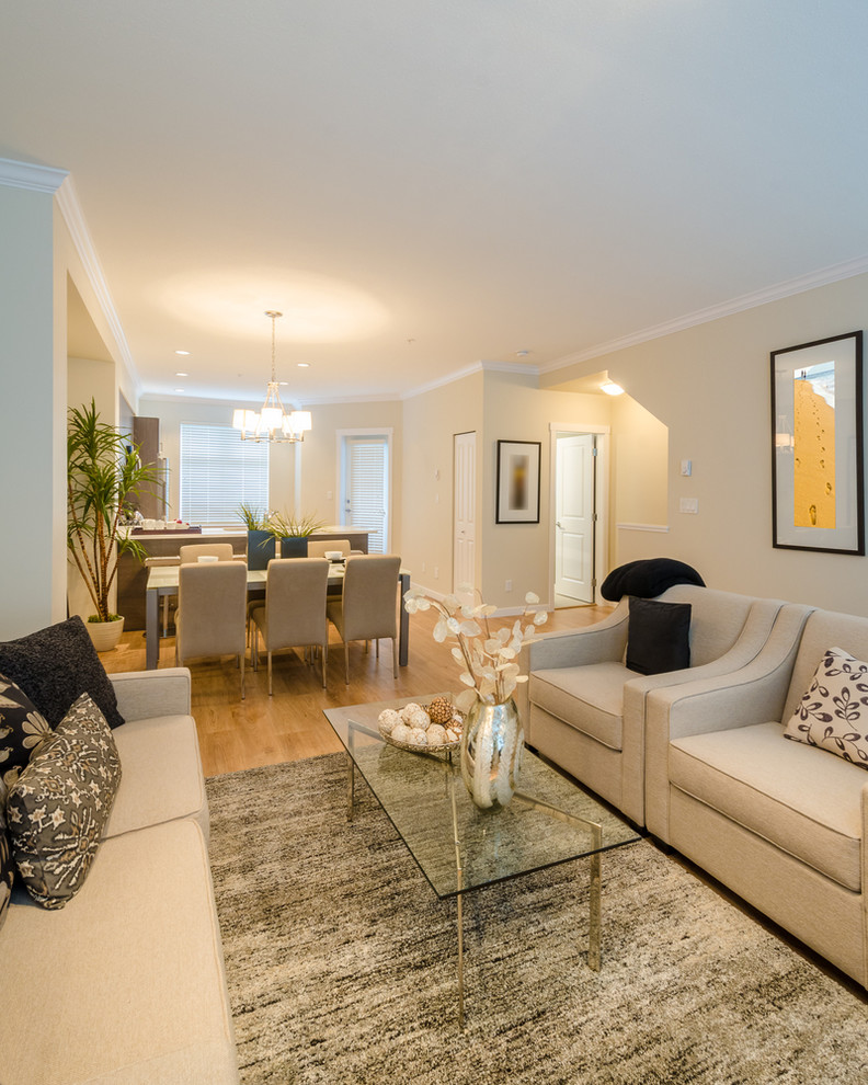 Inspiration for a small contemporary open concept light wood floor living room remodel in DC Metro with beige walls, no fireplace and no tv