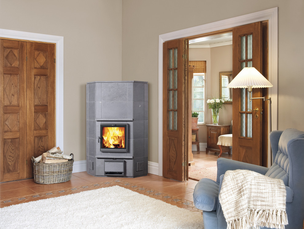 Example of a large danish living room design in Gloucestershire with a wood stove