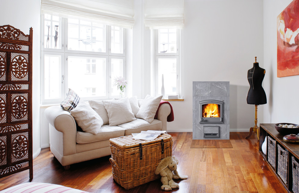 Photo of a large scandinavian living room in Gloucestershire with a wood burning stove.