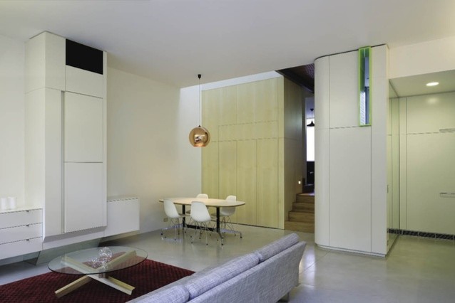 This is an example of a contemporary open plan living room in Sydney with concrete flooring.