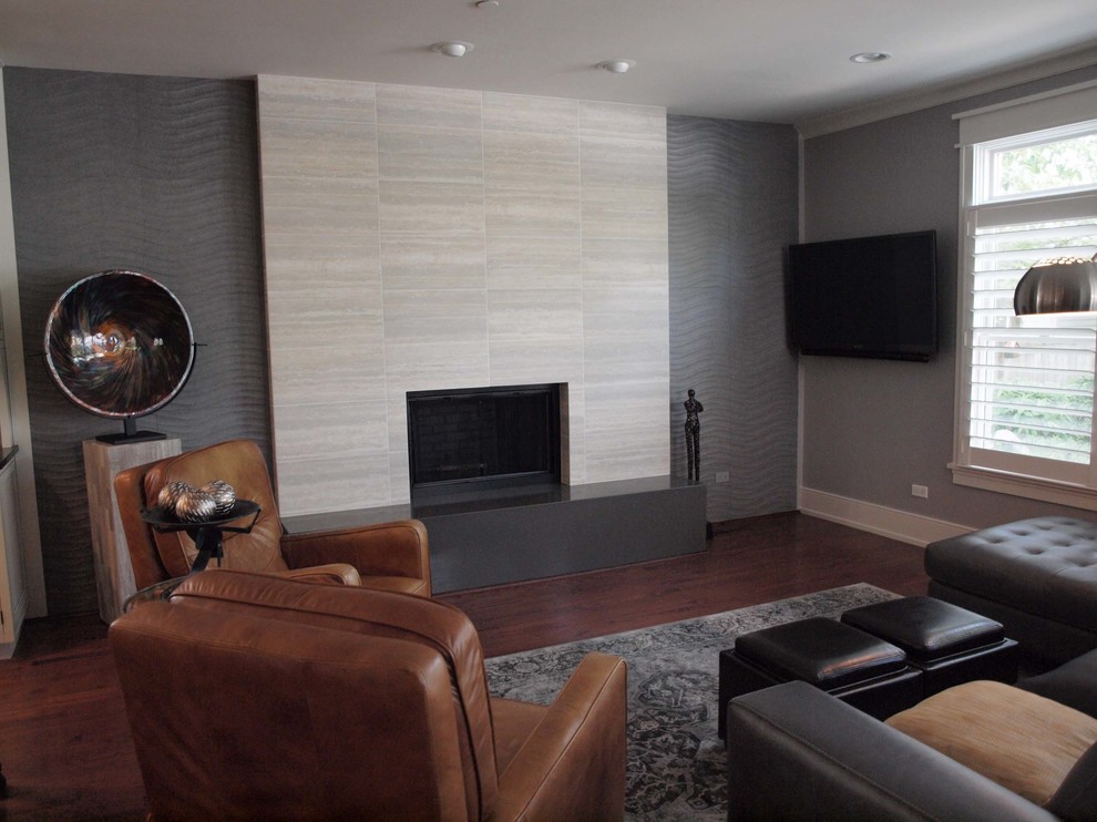 Photo of a medium sized contemporary formal enclosed living room in Chicago with grey walls, a standard fireplace, a tiled fireplace surround, a wall mounted tv and dark hardwood flooring.