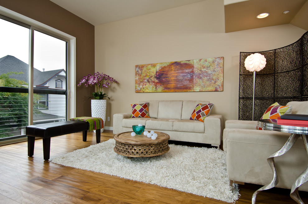 Contemporary living room in Portland with beige walls.