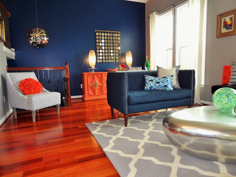 Idee per un soggiorno design aperto con sala formale e pareti blu