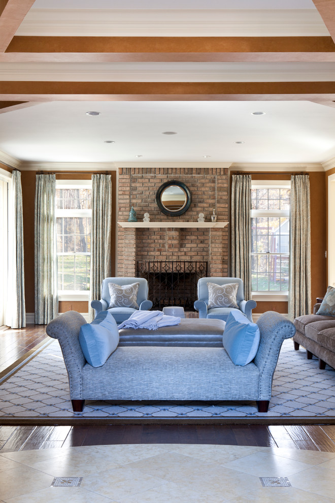 Photo of a medium sized classic formal enclosed living room in Los Angeles with brown walls, dark hardwood flooring, a standard fireplace, a brick fireplace surround and brown floors.