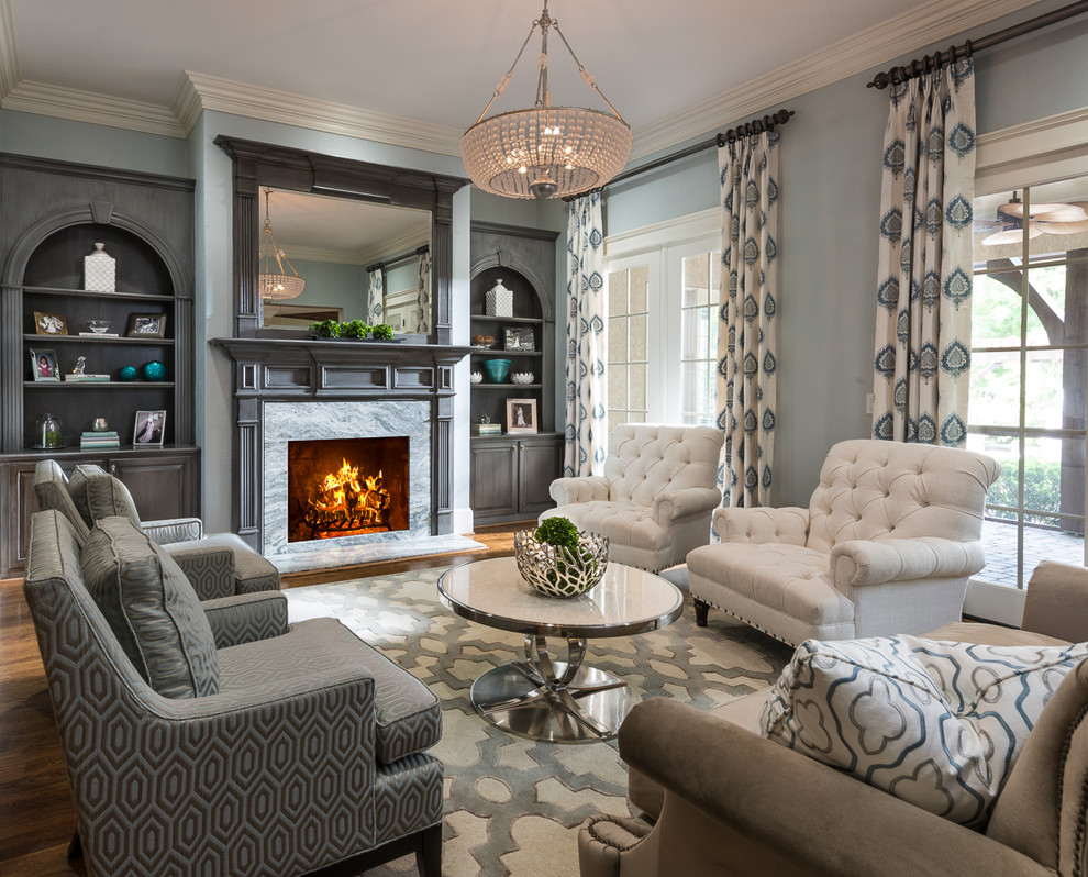 Inspiration for a classic formal living room curtain in Charlotte with blue walls and a standard fireplace.