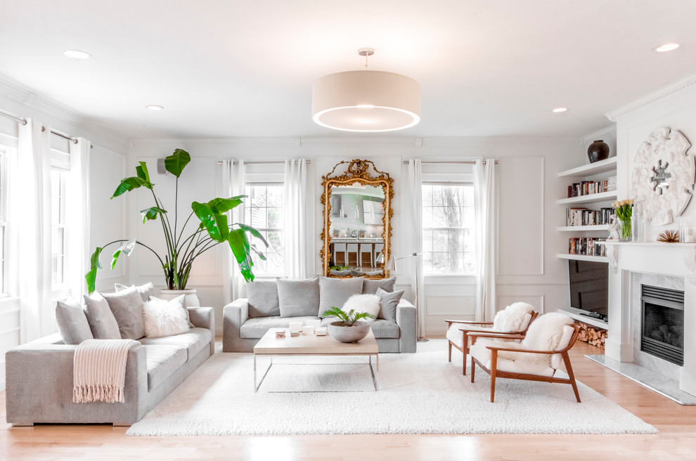 Living room - transitional light wood floor and beige floor living room idea in Boston with white walls, a standard fireplace and a tv stand