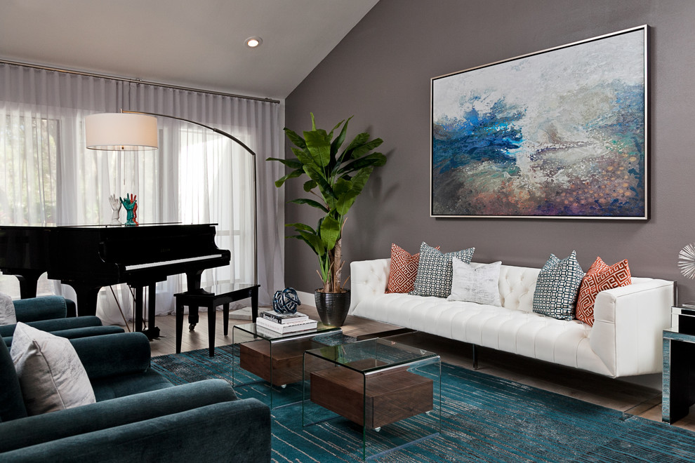 Contemporary grey and teal living room in Other with feature lighting.