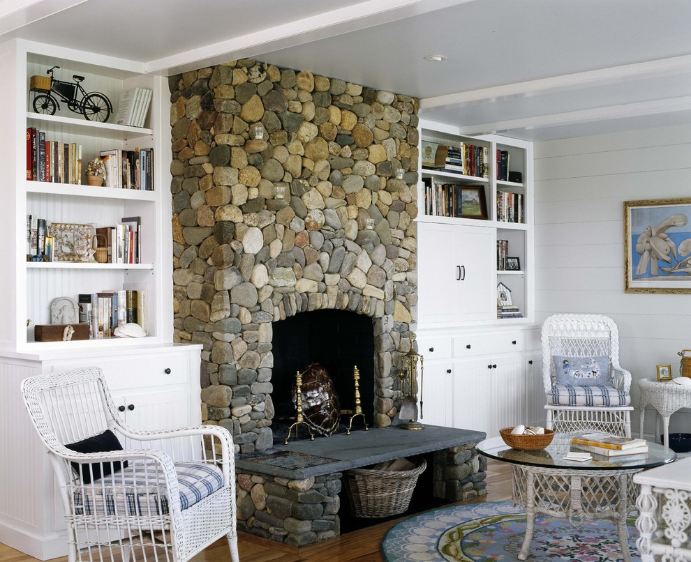 Beach style living room photo in Boston with a stone fireplace