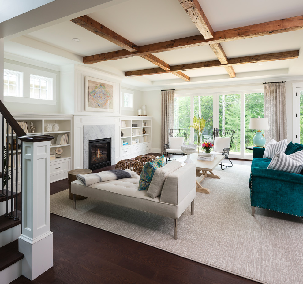 Photo of a large beach style living room in Minneapolis with white walls, dark hardwood flooring, a standard fireplace, a wooden fireplace surround, no tv and brown floors.