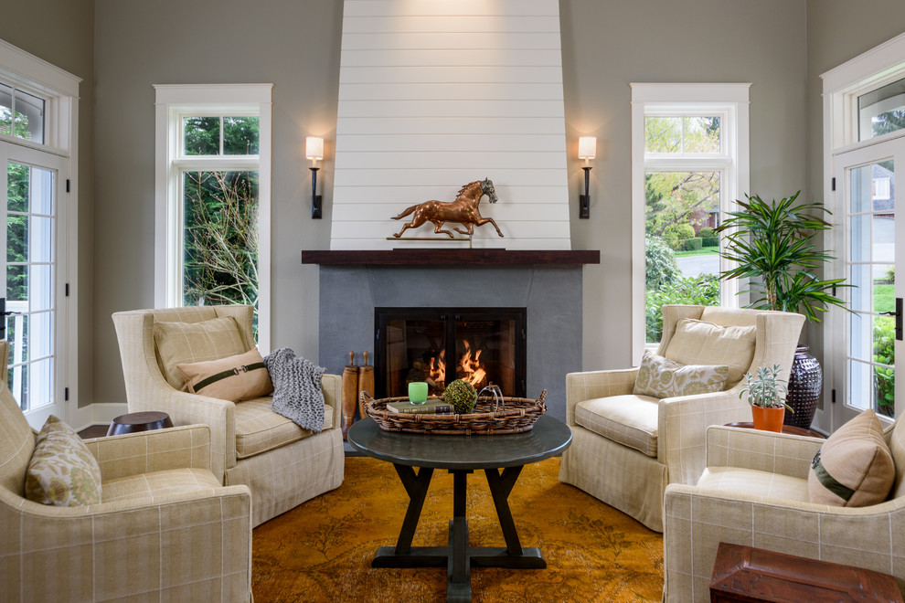 This is an example of a country formal living room in Seattle with grey walls and a standard fireplace.