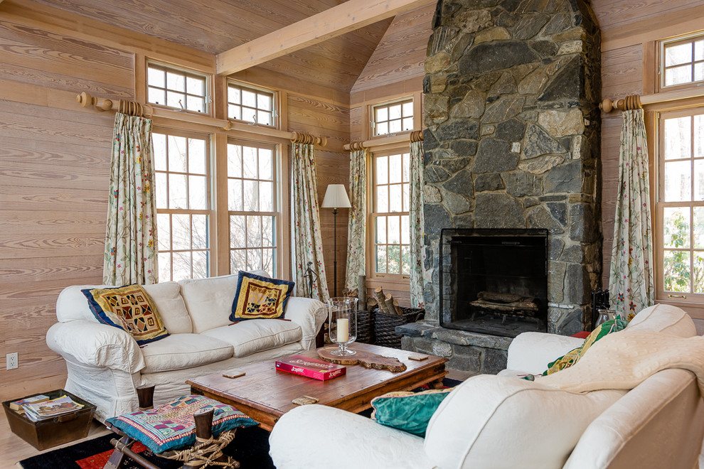 Example of a mid-sized cottage open concept living room design in Boston with a stone fireplace, a standard fireplace and no tv