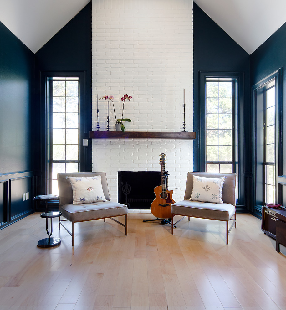 Example of a large transitional open concept light wood floor and beige floor living room design in Austin with a music area, blue walls, a standard fireplace, a brick fireplace and no tv